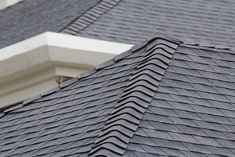new asphalt shingles roof installed at residential property close up